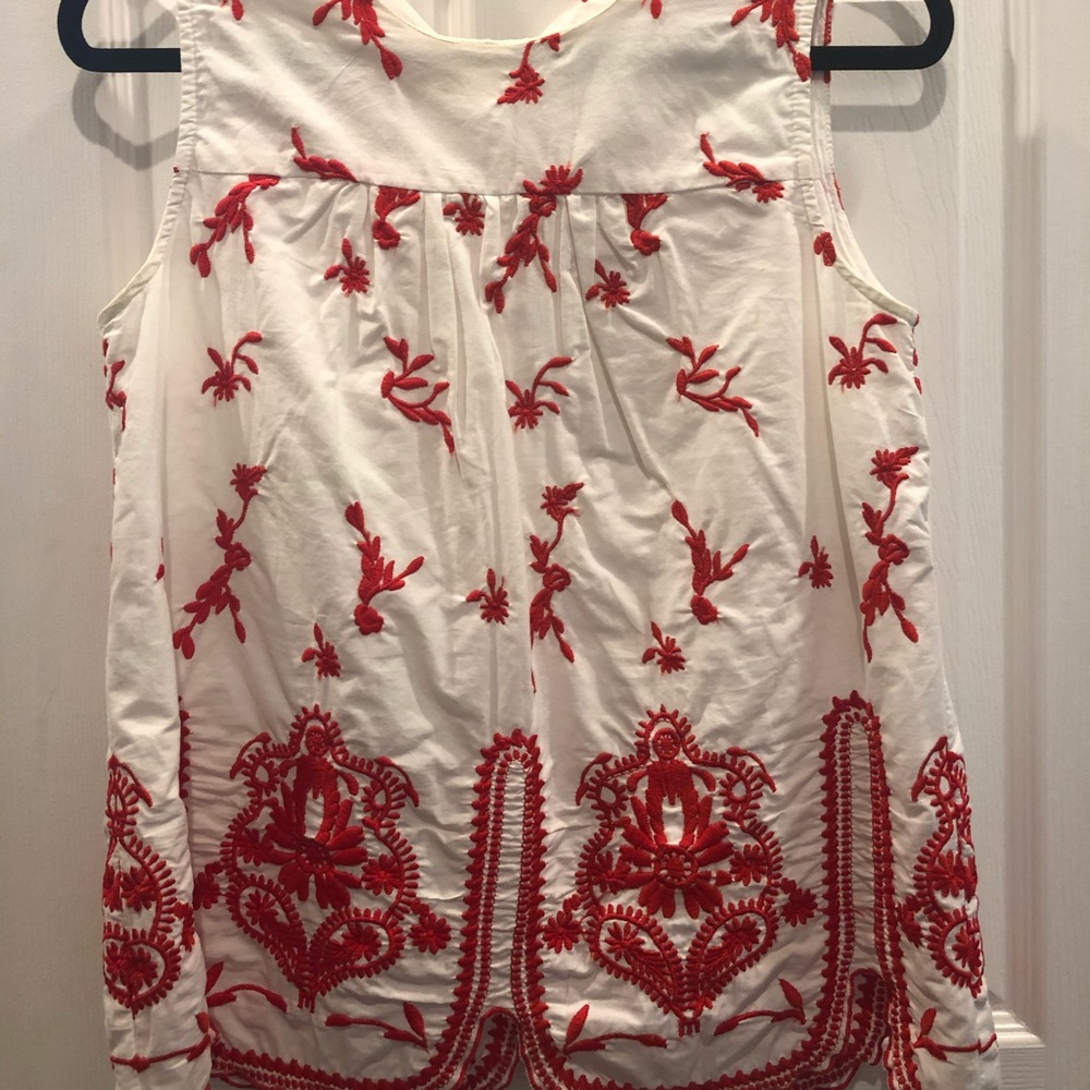 Red and white sleeveless blouse
